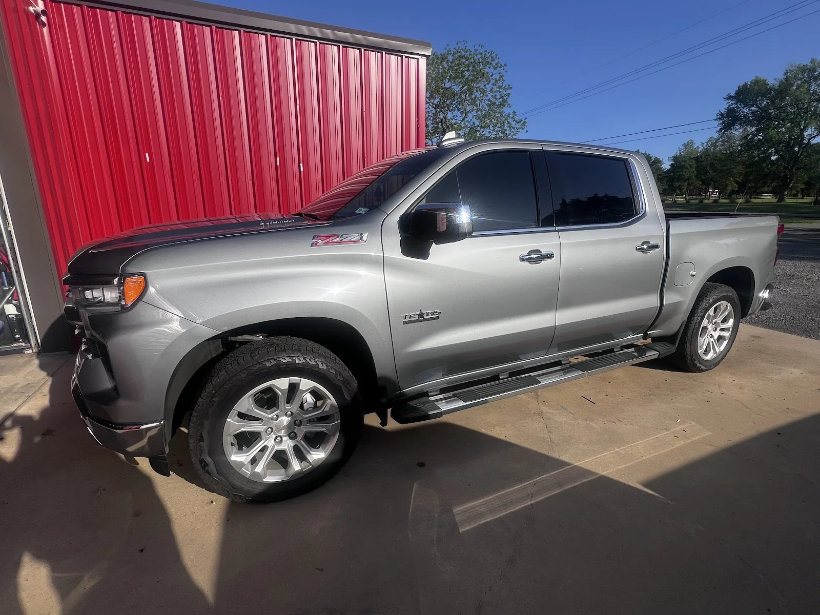 Fresh tint on a blacked-out SUV by Scott’s Tint and Graphics