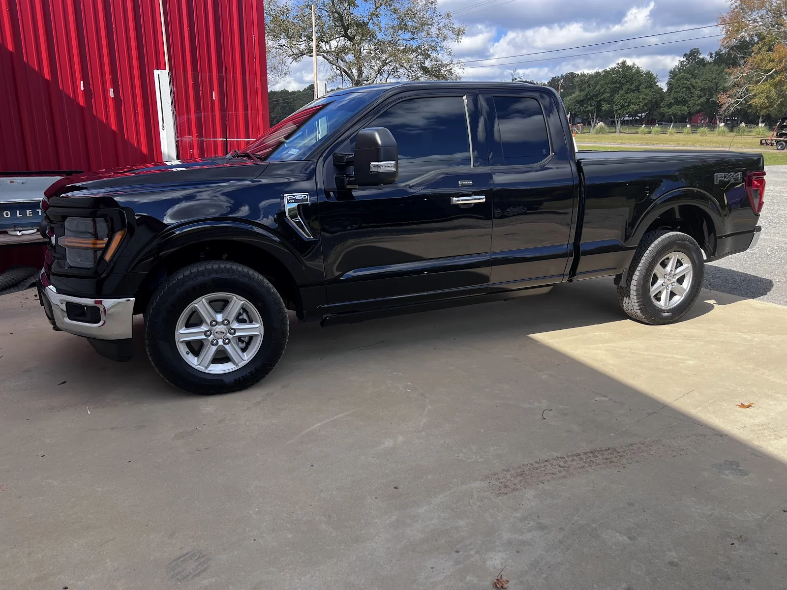 Window tint install on a silver Chevy at Scott’s Tint and Graphics